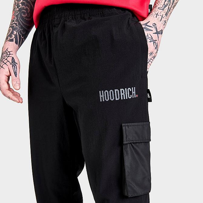 On Model 5 view of Men's Hoodrich OG Fatal Woven Track Pants in Black/Irongate/Lychee Click to zoom