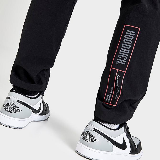 On Model 6 view of Men's Hoodrich OG Fatal Woven Track Pants in Black/Irongate/Lychee Click to zoom