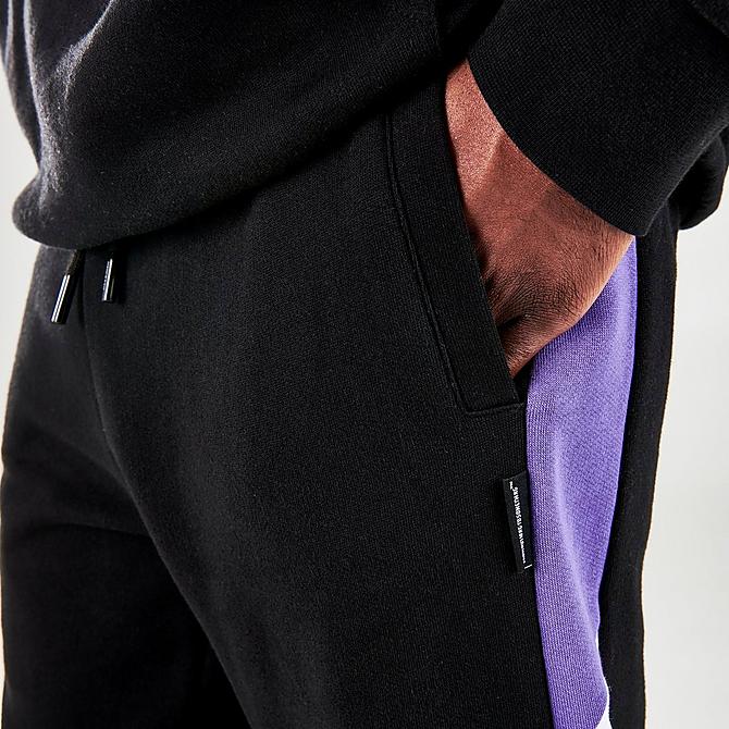 On Model 5 view of Men's Hoodrich Oxen Jogger Pants in Black/White/Purple Click to zoom