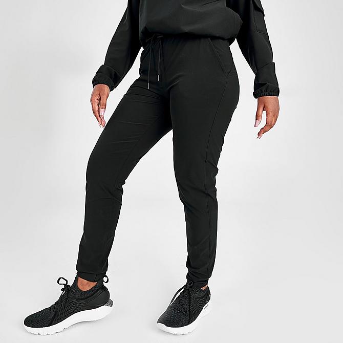 Front Three Quarter view of Women's Under Armour Sport Woven Jogger Pants in Black/Metallic Silver Click to zoom