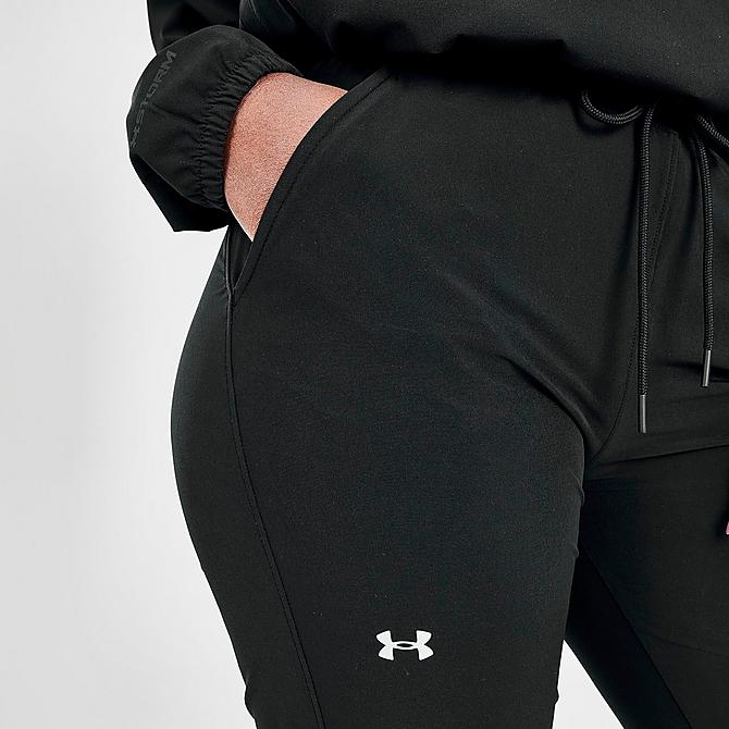 On Model 5 view of Women's Under Armour Sport Woven Jogger Pants in Black/Metallic Silver Click to zoom