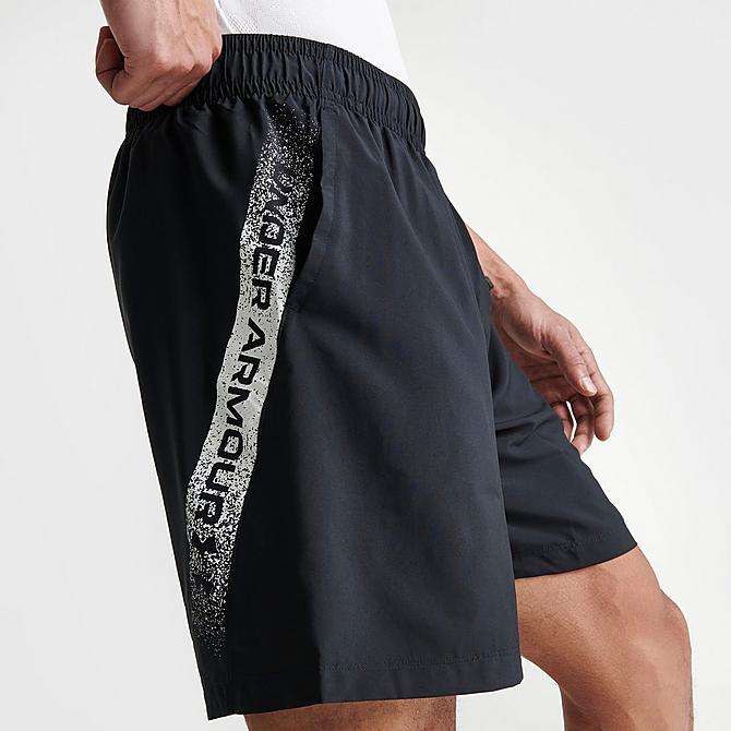 On Model 5 view of Men's Under Armour Woven Graphic Shorts in Black Click to zoom