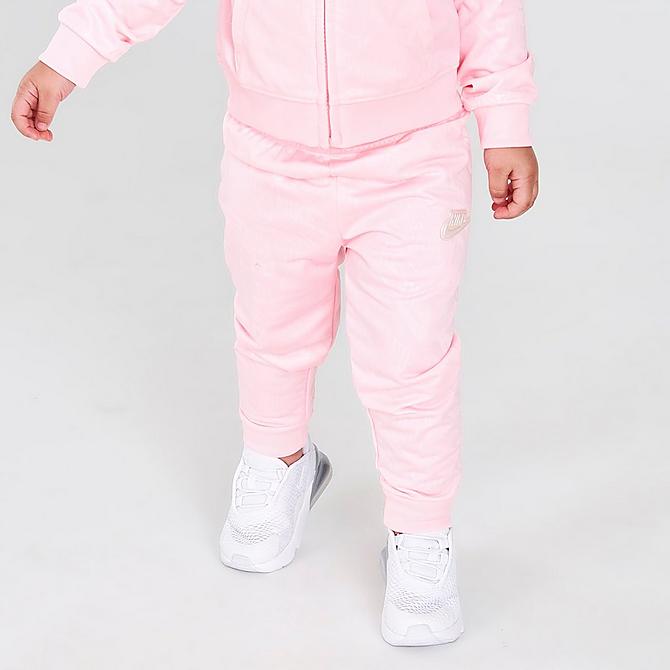 [angle] view of Girls' Infant Nike Debossed Futura Tricot Track Jacket and Joggers Set in Arctic Punch Click to zoom