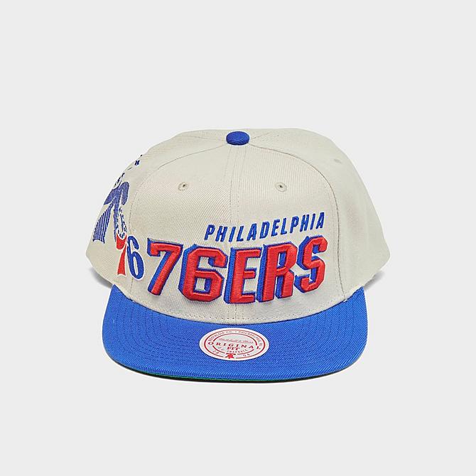 Three Quarter view of Mitchell & Ness NBA Philadelphia 76ers Draft Day 96 Snapback Hat in Cream Click to zoom