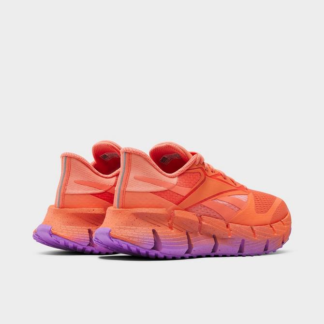Left view of Women's Reebok Floatzig 1 Running Shoes in Coral/Coral/Purple Click to zoom