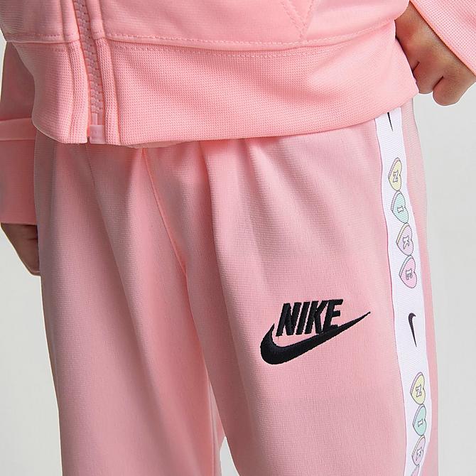 [angle] view of Girls' Toddler Nike Swoosh Love Tricot Track Jacket and Jogger Pants Set in Arctic Pink Click to zoom