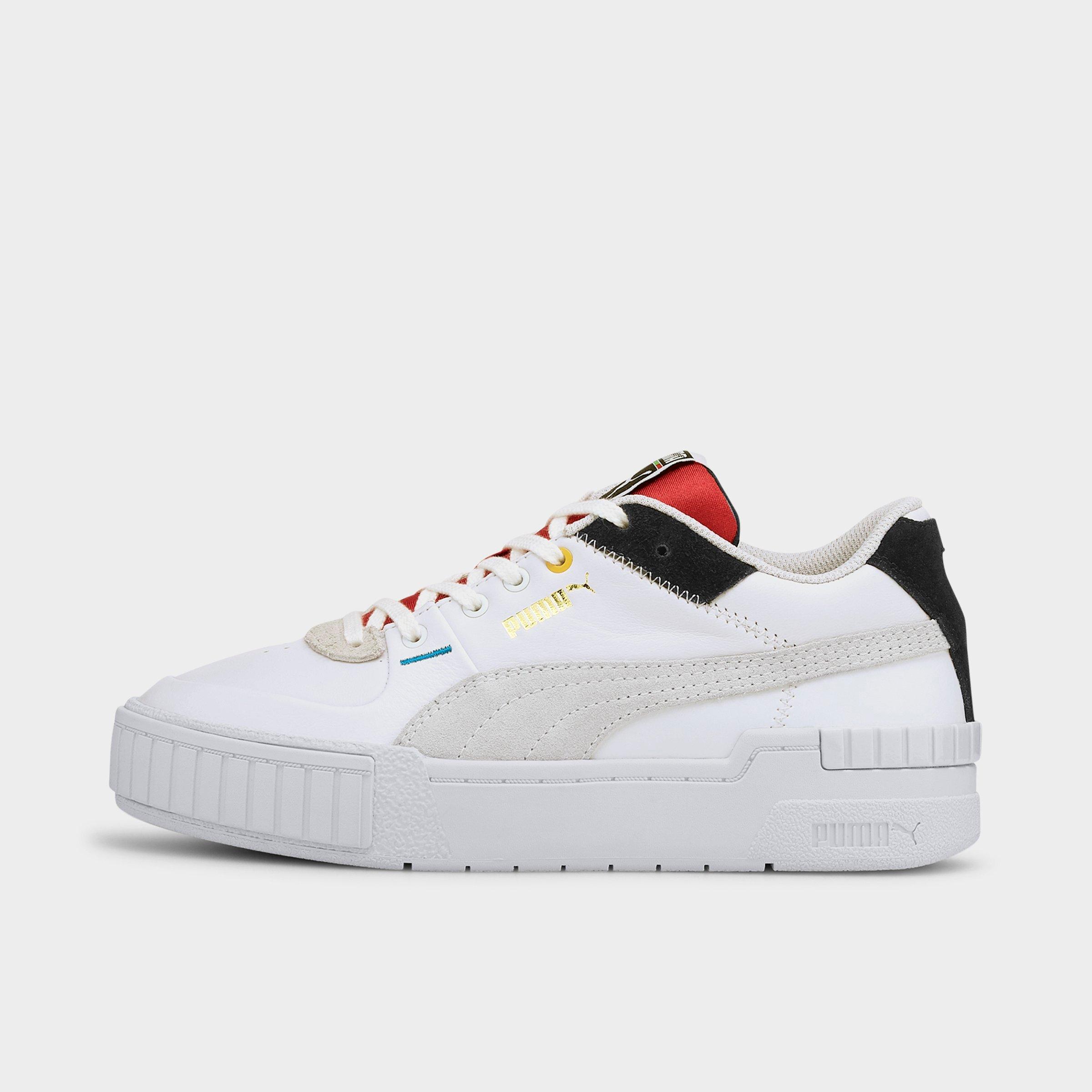 white puma shoes with black stripe