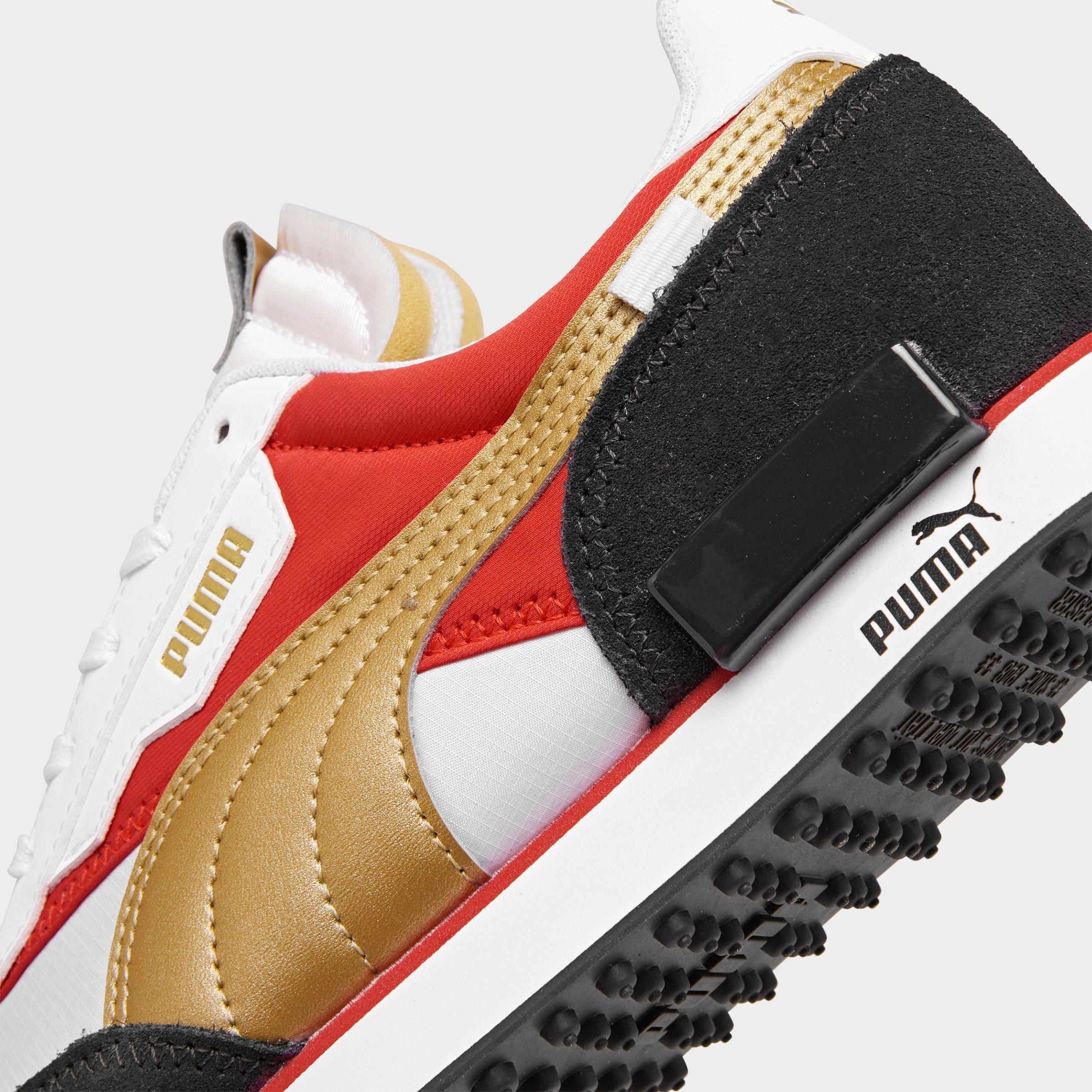 white and gold puma shoes