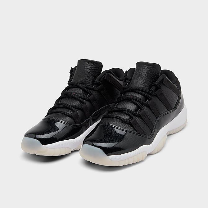 Three Quarter view of Big Kids' Air Jordan Retro 11 Low Basketball Shoes in Black/Gym Red/White/Sail Click to zoom