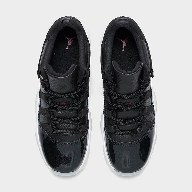 Back view of Big Kids' Air Jordan Retro 11 Low Basketball Shoes in Black/Gym Red/White/Sail Click to zoom