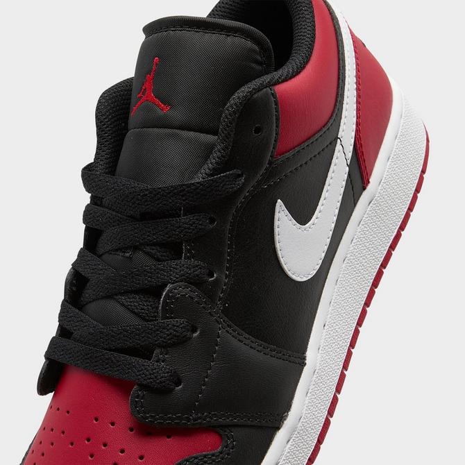 Air Jordan 1 low sneakers in black and gym red