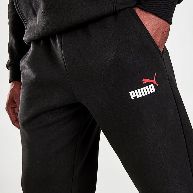 On Model 5 view of Men's Puma Logo Jogger Pants in Black Click to zoom