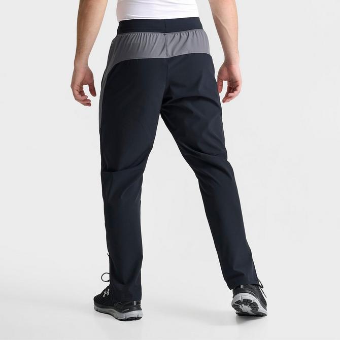 [angle] view of Men's Under Armour UA Storm Woven Pants in Black/Grey Click to zoom