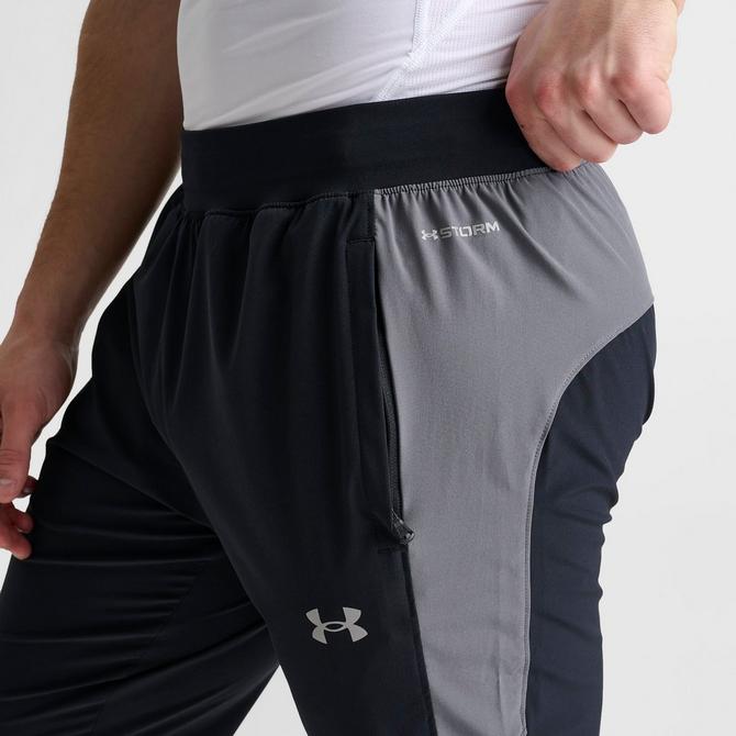 [angle] view of Men's Under Armour UA Storm Woven Pants in Black/Grey Click to zoom