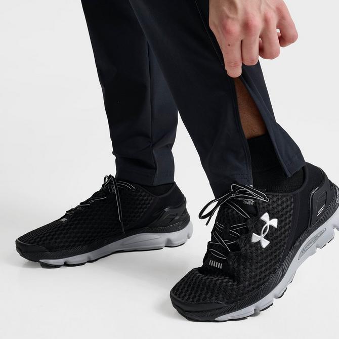 [angle] view of Men's Under Armour UA Storm Woven Pants in Black/Grey Click to zoom