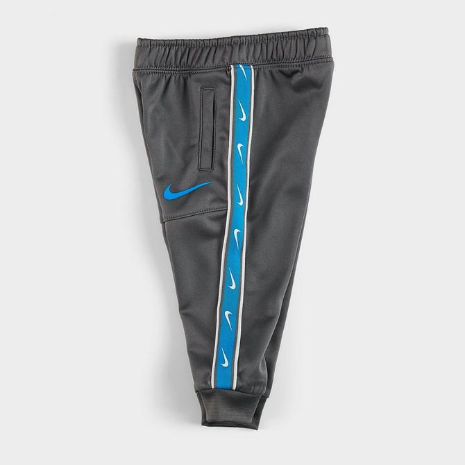 taped nike pants