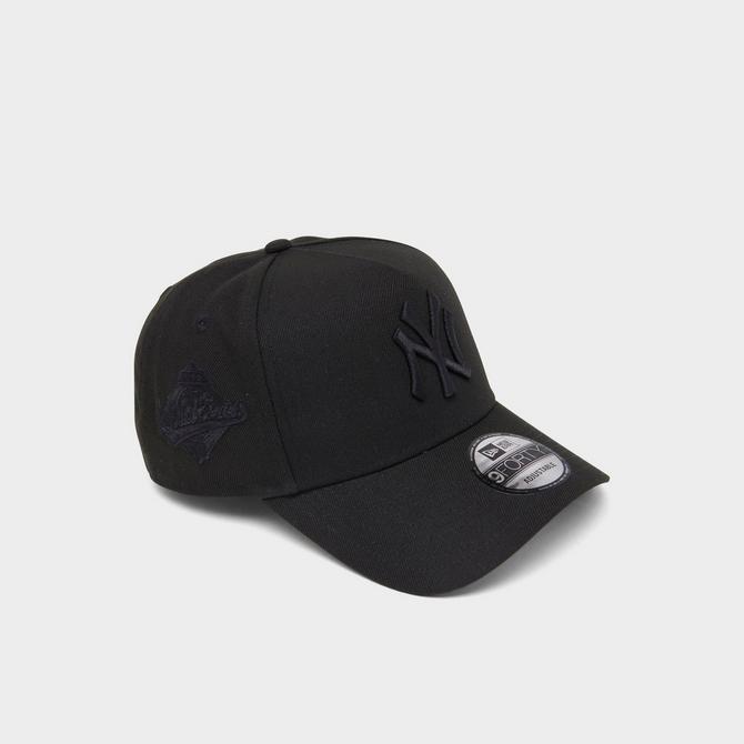 Black Nike Sneaker with Black New Era New York Yankees Cap Stock