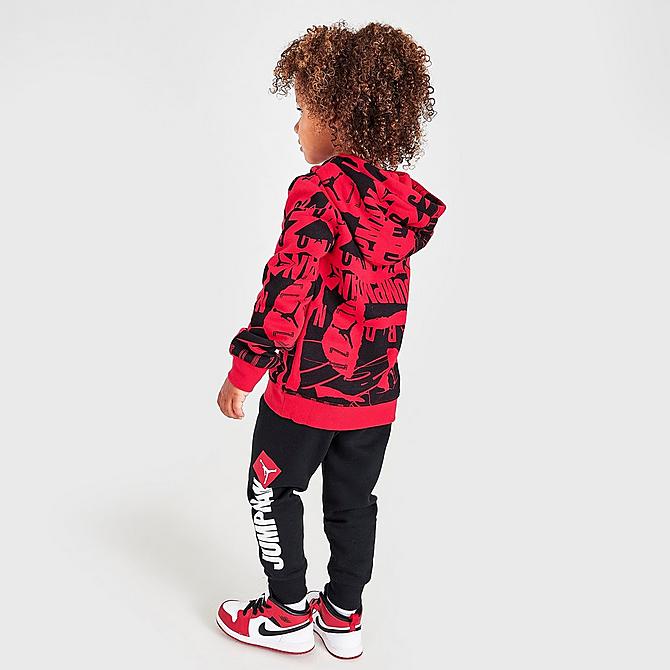 Front Three Quarter view of Boys' Toddler Jordan Essentials Fleece AOP Hoodie and Jogger Pants Set in Red/Black/White Click to zoom