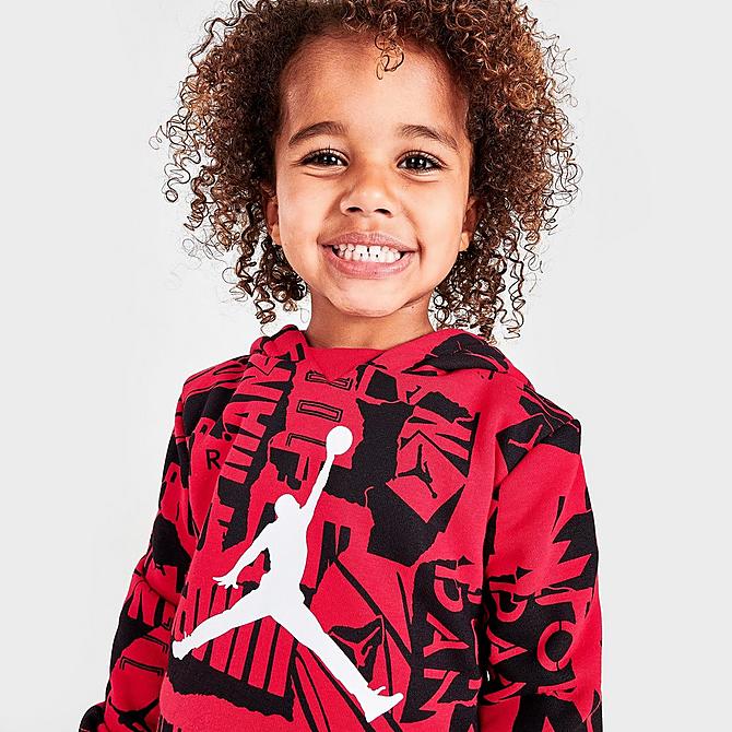 On Model 6 view of Boys' Toddler Jordan Essentials Fleece AOP Hoodie and Jogger Pants Set in Red/Black/White Click to zoom