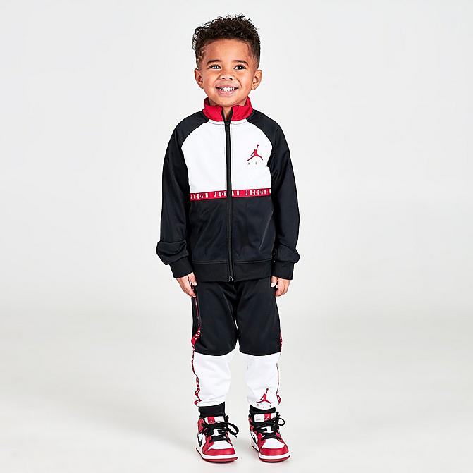 Front view of Boys' Toddler Jordan Air Blocked Tricot Track Jacket and Jogger Pants Set in Black/White/Red Click to zoom