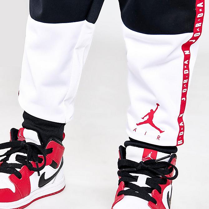 On Model 6 view of Boys' Toddler Jordan Air Blocked Tricot Track Jacket and Jogger Pants Set in Black/White/Red Click to zoom