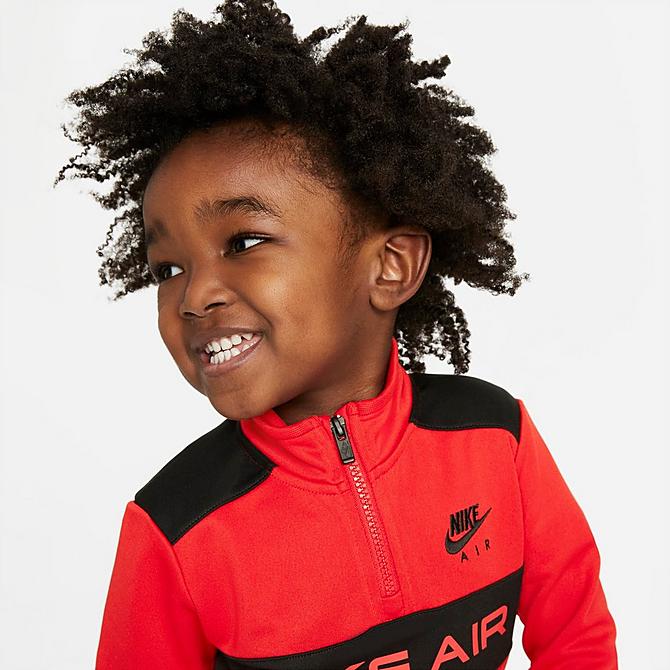 Back Left view of Boys' Toddler Nike Air Tricot Half-Zip Pullover and Jogger Pants Set in University Red/Black Click to zoom