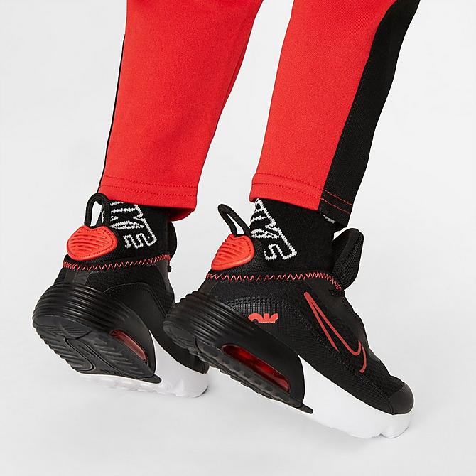 On Model 6 view of Boys' Toddler Nike Air Tricot Half-Zip Pullover and Jogger Pants Set in University Red/Black Click to zoom