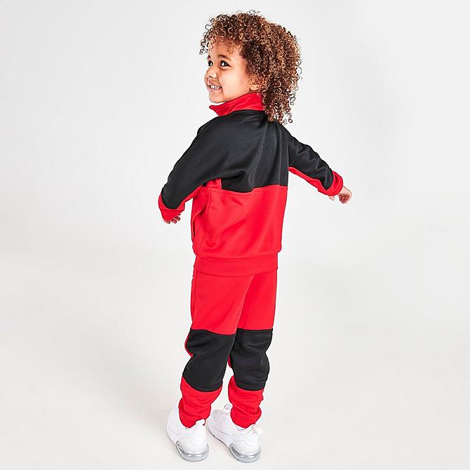 Front Three Quarter view of Boys' Toddler Nike Air Tricot Half-Zip Top and Joggers Set in University Red Click to zoom