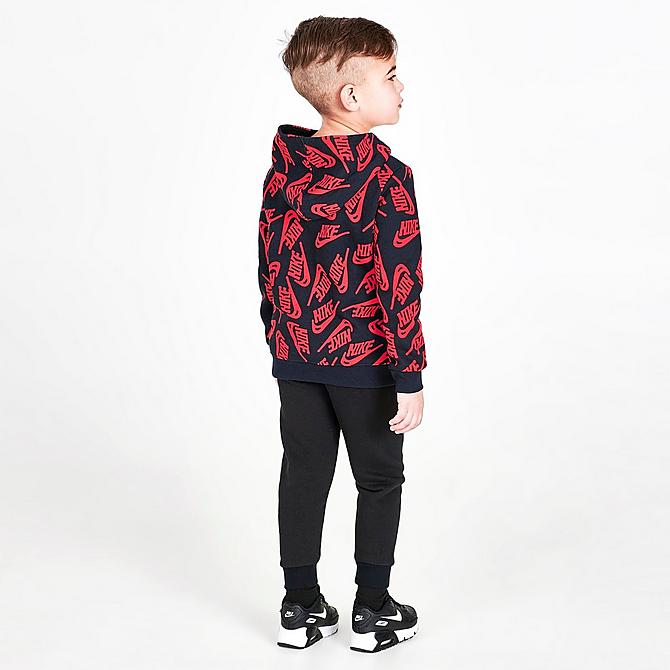 Front Three Quarter view of Boys' Toddler Nike Sportswear Futura Toss Allover Print Fleece Hoodie and Jogger Pants Set in Black/University Red/White Click to zoom