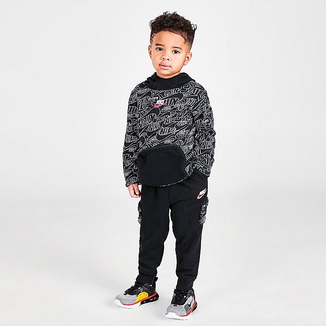 Front Three Quarter view of Boys' Toddler Nike Read Allover Print Jogger Pants in Black/White Click to zoom