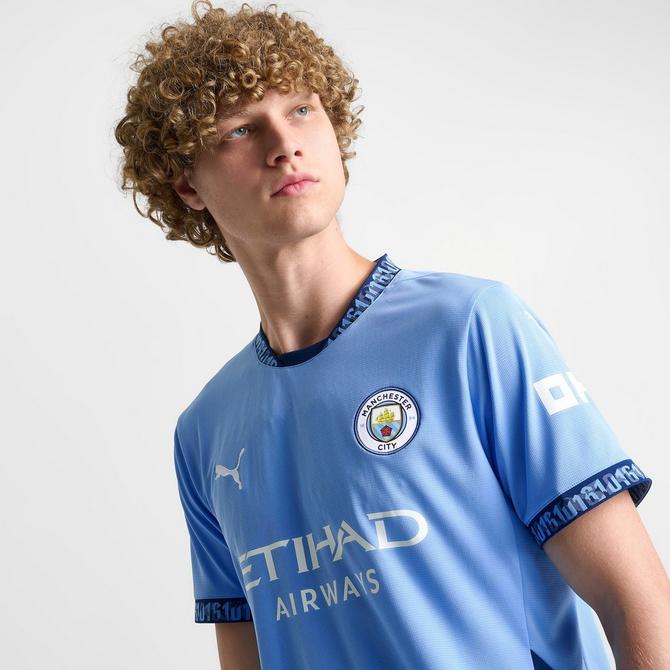[angle] view of Men's Puma Manchester City 24-25 Home Replica Soccer Jersey in Team Light Blue/Marine Blue Click to zoom