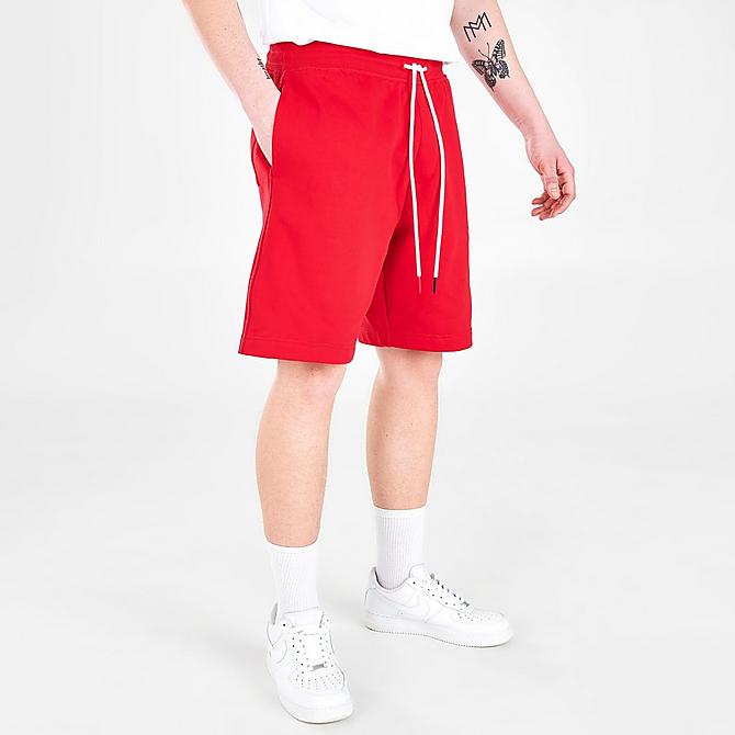 Back Left view of Men's Tommy Jeans Drawstring Fleece Shorts in Blush Red Click to zoom