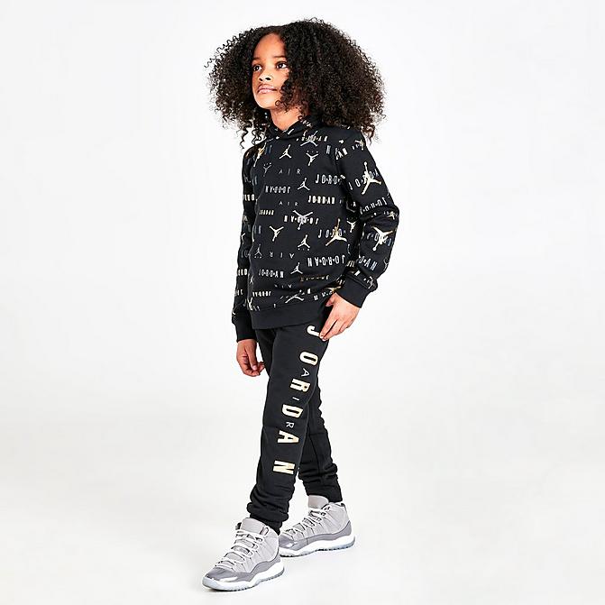 Front view of Boys' Little Kids' Jordan Highlight Allover Print Fleece Hoodie and Jogger Pants Set in Black/Gold Click to zoom