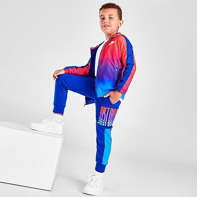 Front view of Boys' Little Kids' Nike Rise Fleece Jogger Pants in Blue/Multi Click to zoom