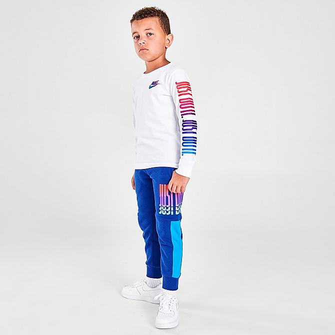 Front Three Quarter view of Boys' Little Kids' Nike Rise Fleece Jogger Pants in Blue/Multi Click to zoom