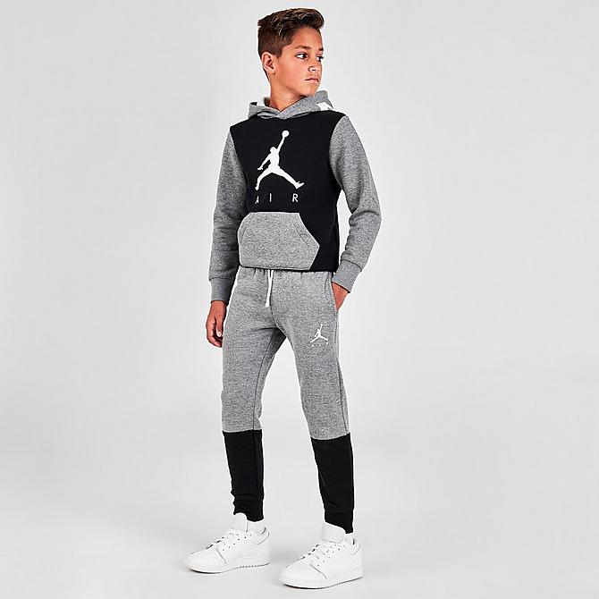 Front Three Quarter view of Boys' Jordan Air Colorblock Fleece Jogger Pants in Carbon Heather/Black Click to zoom