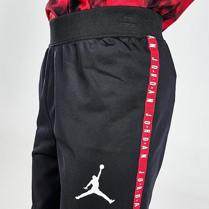 On Model 6 view of Boys' Jordan Tape Track Suit in Black/Red Click to zoom