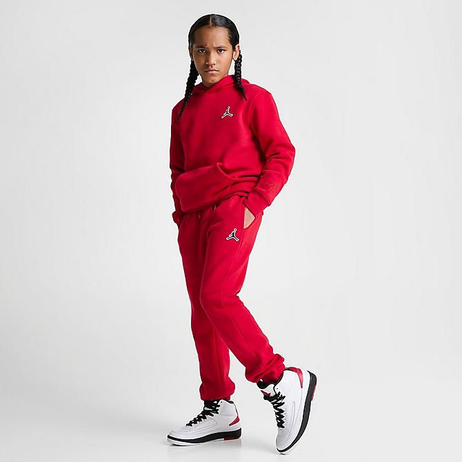 Front Three Quarter view of Boys' Jordan Essentials Jogger Sweatpants in Gym Red Click to zoom