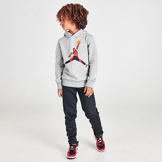 Front Three Quarter view of Kids' Nike Holiday Jumpman Pullover Hoodie in Grey Click to zoom