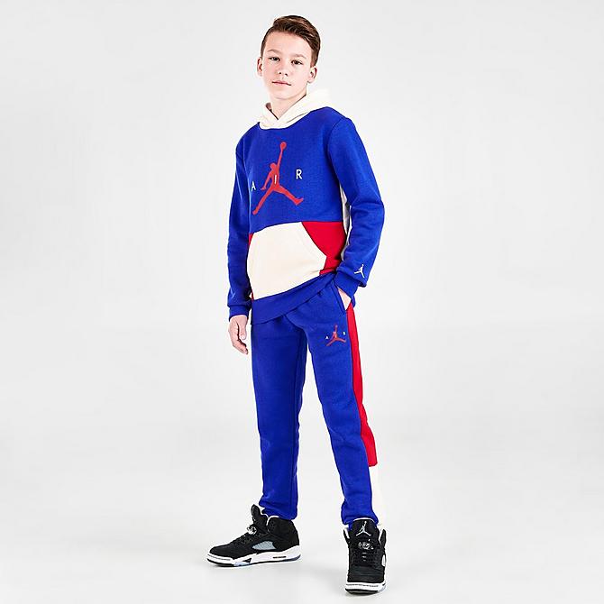 Front Three Quarter view of Boys' Jordan Wild Utility Jogger Pants in Racer Blue/Pearl White/Gym Red Click to zoom
