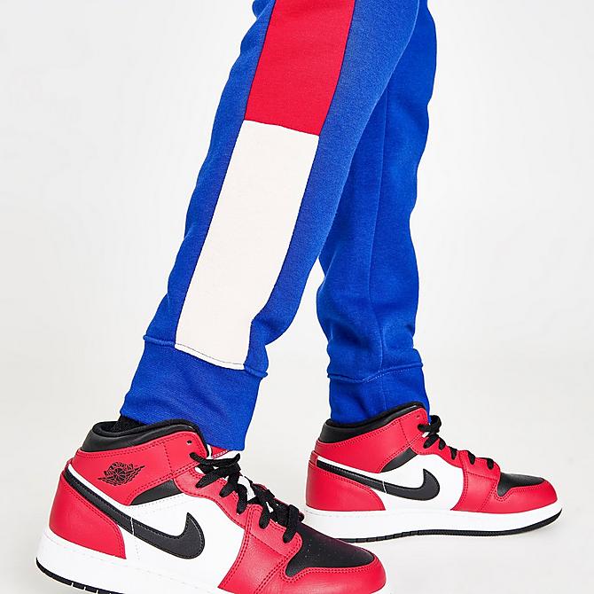 On Model 6 view of Boys' Jordan Wild Utility Jogger Pants in Racer Blue/Pearl White/Gym Red Click to zoom