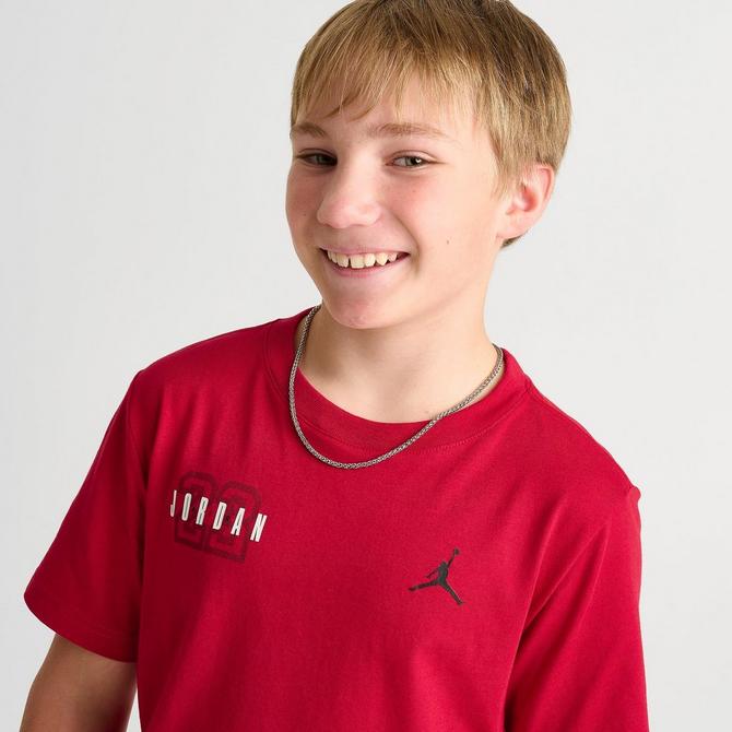 [angle] view of Kids' Jordan Courtyard T-Shirt in Gym Red Click to zoom
