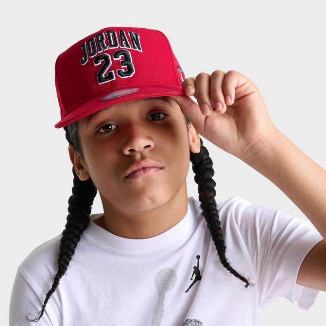 Right view of Big Kids' Jordan Jersey Snapback Hat in Gym Red Click to zoom