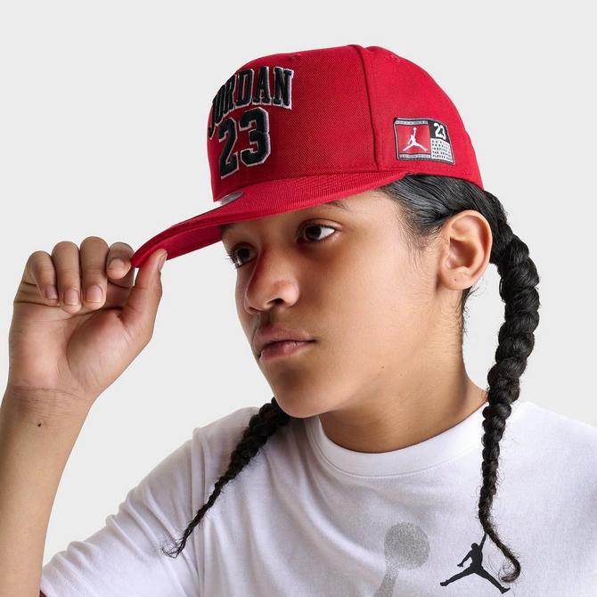 Three Quarter view of Big Kids' Jordan Jersey Snapback Hat in Gym Red Click to zoom