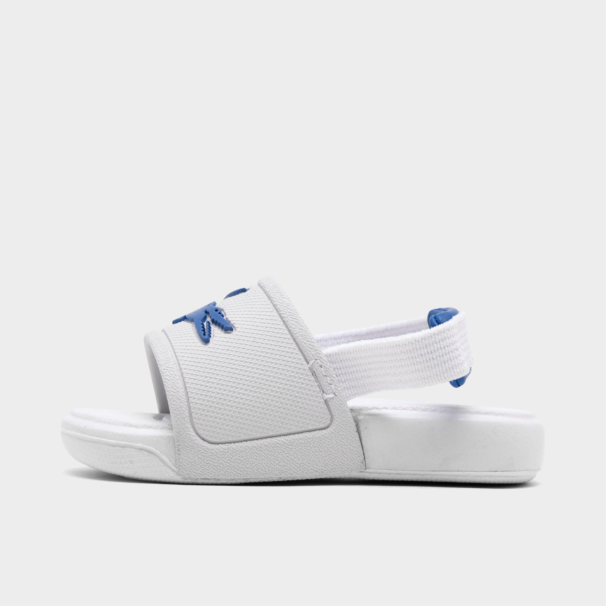 white lacoste slides