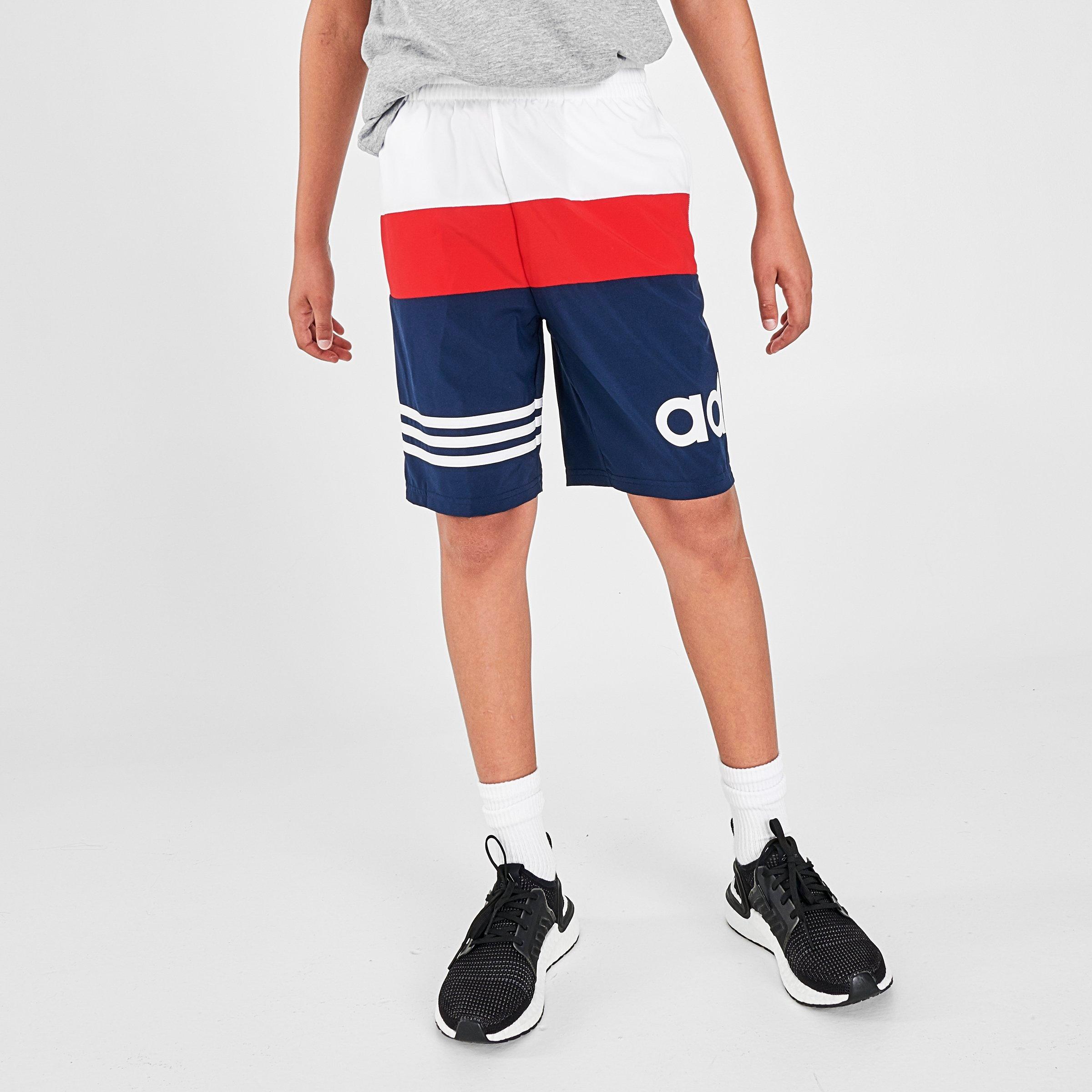 boy in adidas shorts