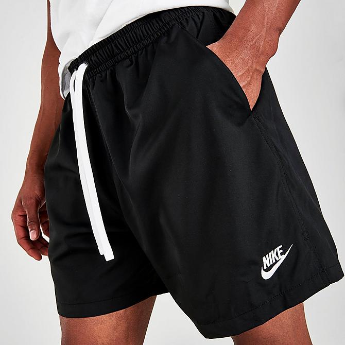 On Model 5 view of Men's Nike Sportswear Flow Woven Shorts in Black/White Click to zoom