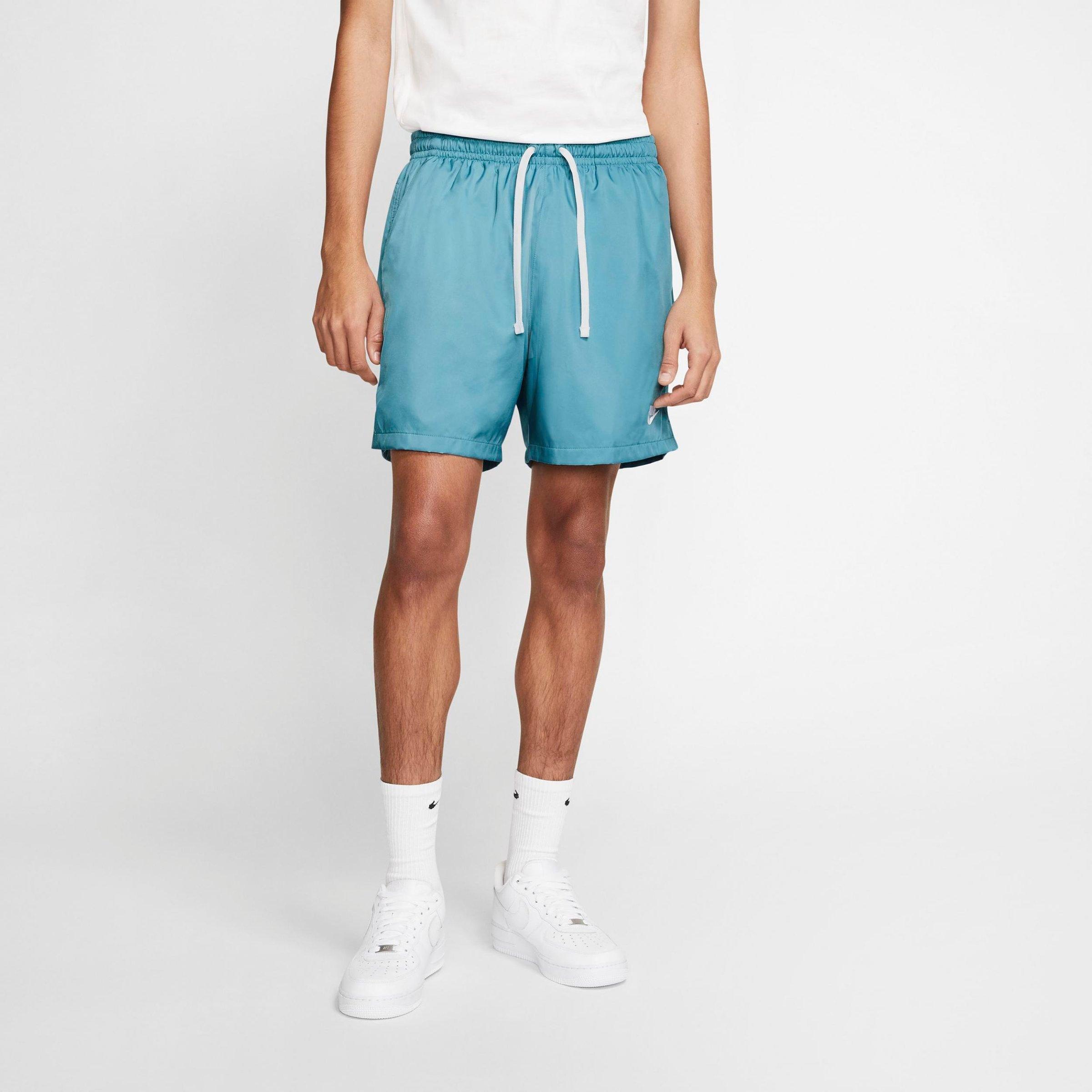 nike club essentials woven flow shorts yellow