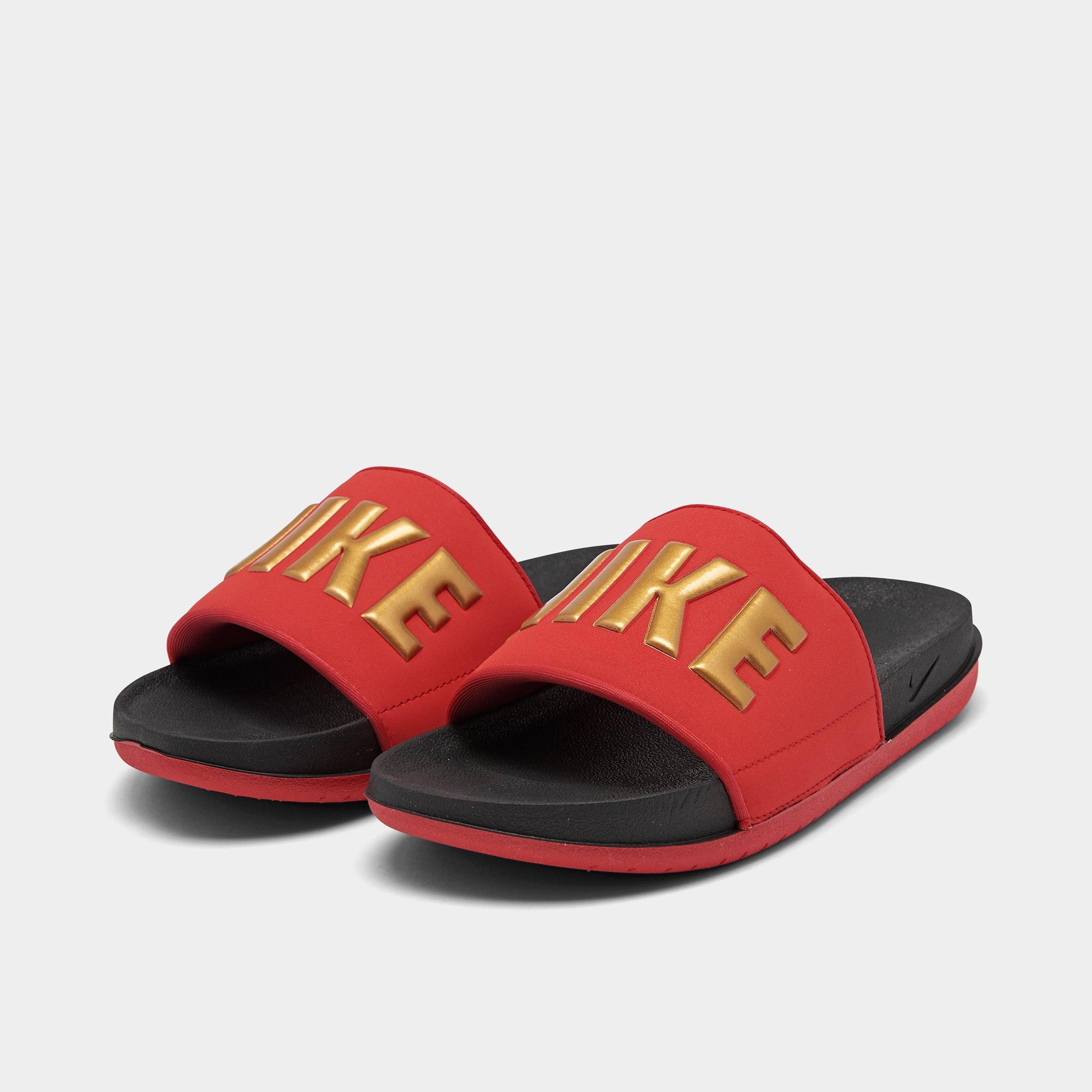 gold and red nike flip flops