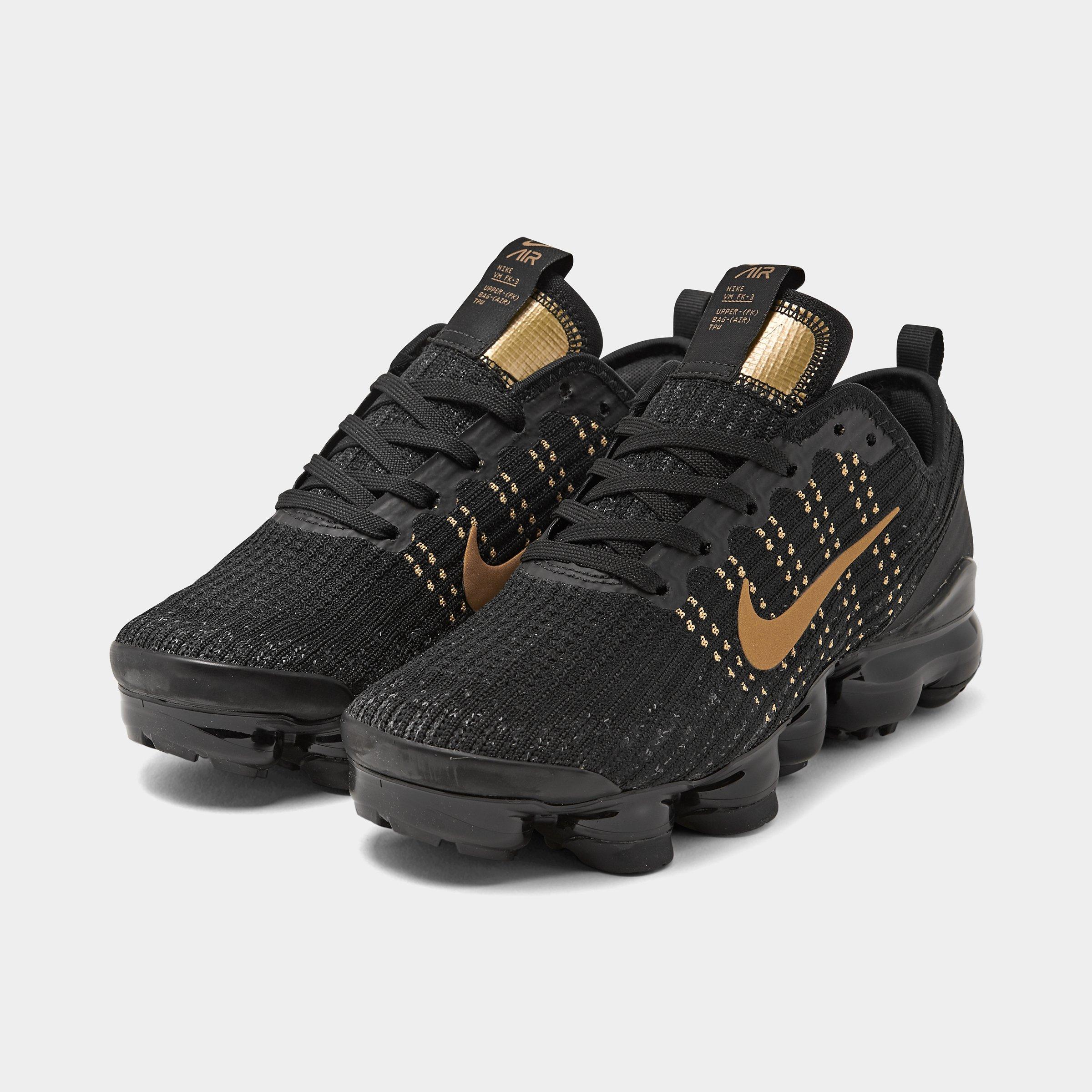 nike flyknit black and gold